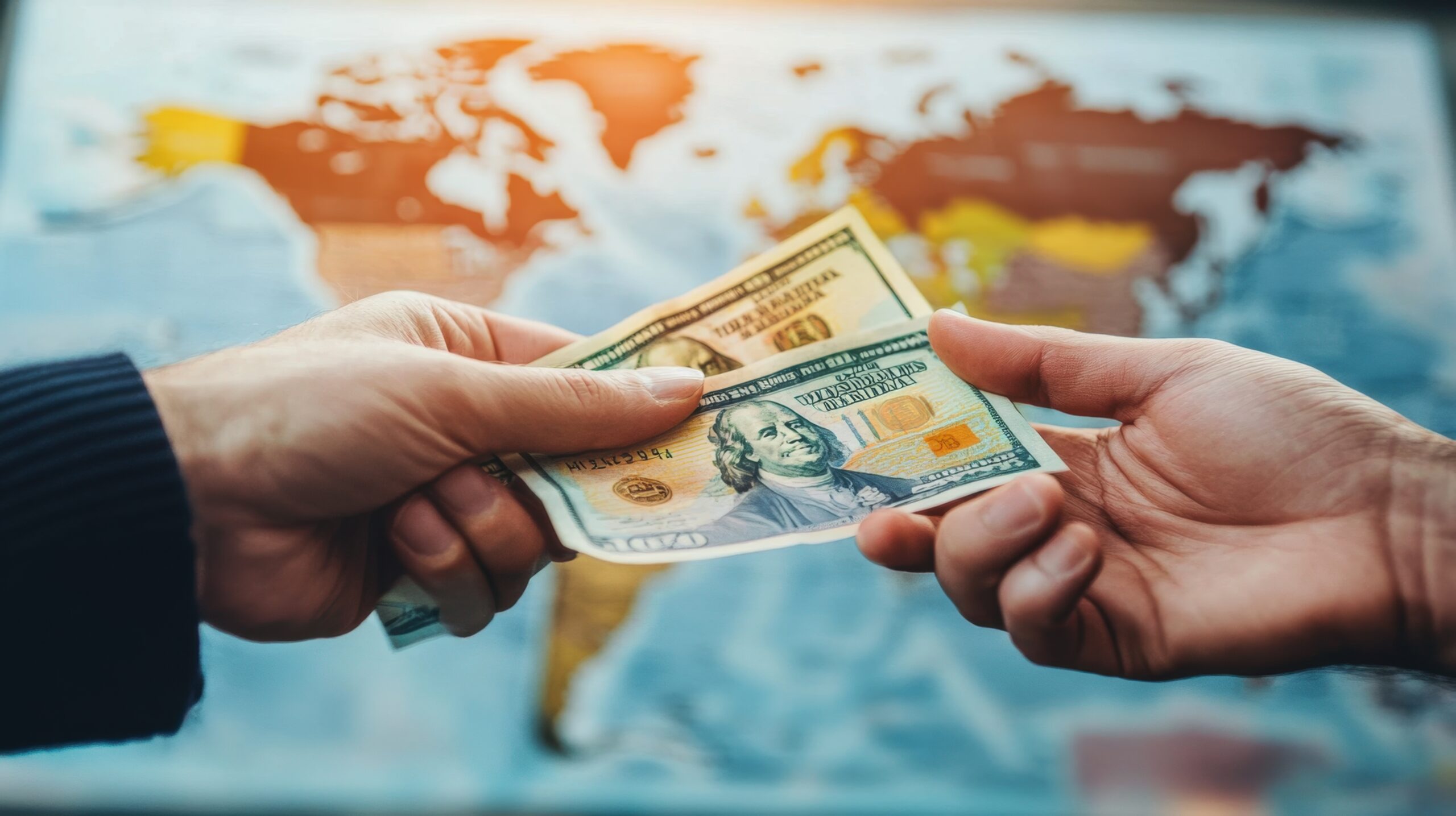 Hands exchanging cash in front of a world map, representing foreigner loan eligibility in Singapore, cross-border financial support, and legal lending guidance for expatriates and overseas workers.